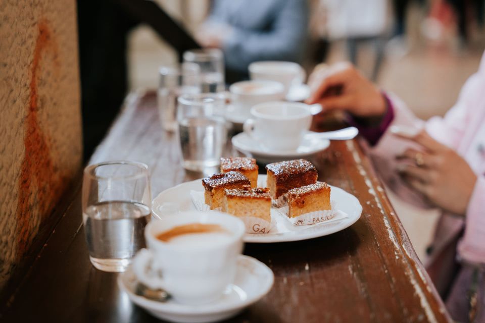 Bologna: Tastes and Traditions Food Tour with Market Visit - Stop 1: Café Pastry Gamberini and the Torta di Riso Kickoff